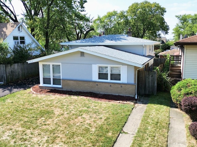 view of property exterior with a lawn