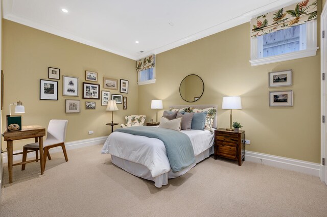 carpeted bedroom with ornamental molding