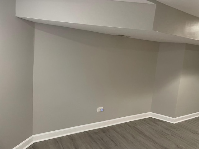 spare room featuring dark hardwood / wood-style floors