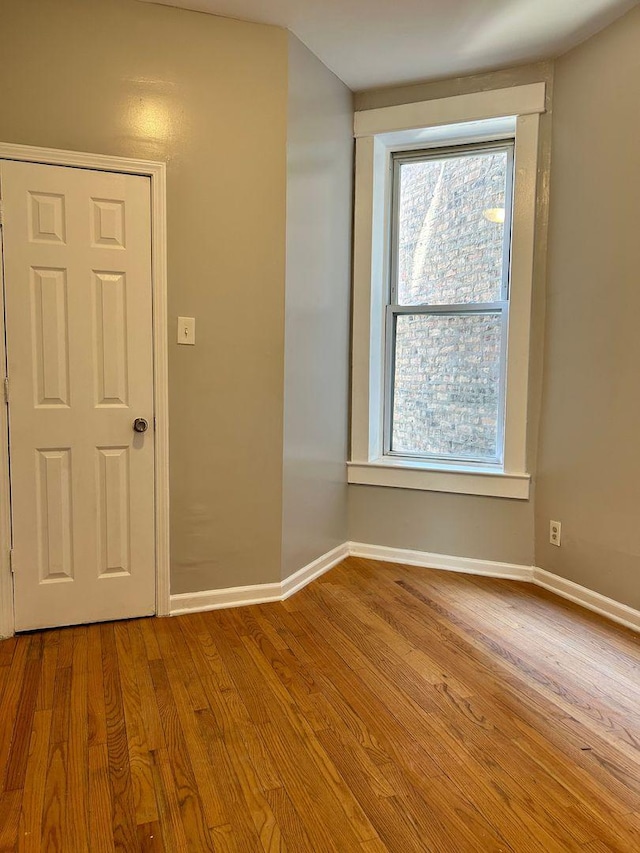 unfurnished room featuring light hardwood / wood-style floors