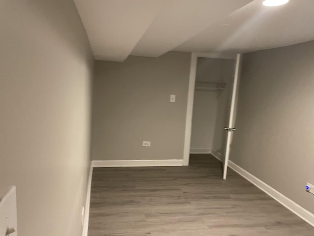 unfurnished bedroom with a closet and hardwood / wood-style floors