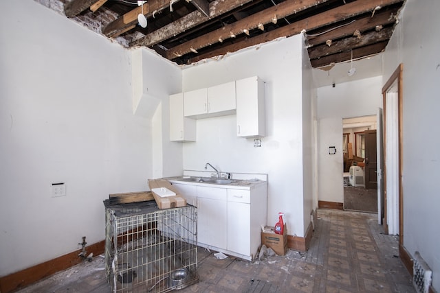 clothes washing area featuring sink