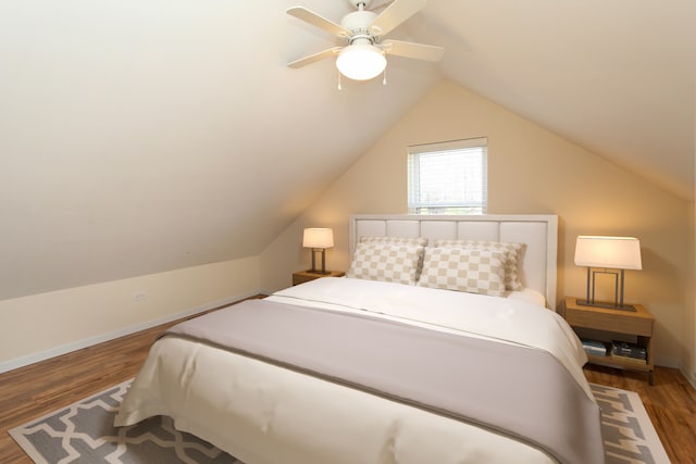 bedroom featuring vaulted ceiling, ceiling fan, and hardwood / wood-style flooring