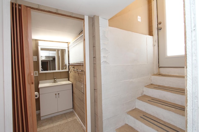 bathroom with tile floors and oversized vanity