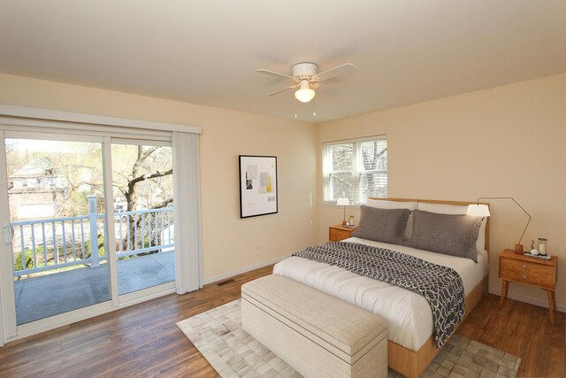 bedroom with access to exterior, ceiling fan, and dark hardwood / wood-style flooring