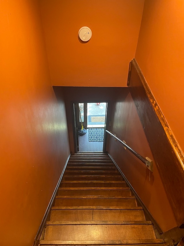 stairway with wood-type flooring