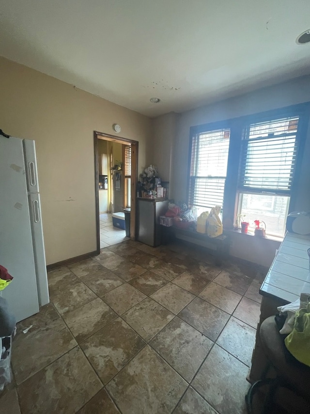 interior space featuring dark tile flooring