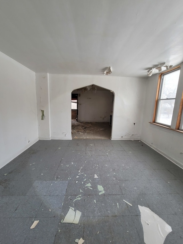 unfurnished living room featuring tile floors