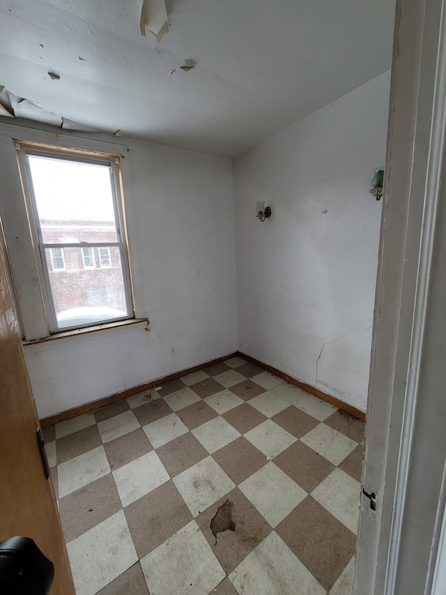 empty room with light tile floors