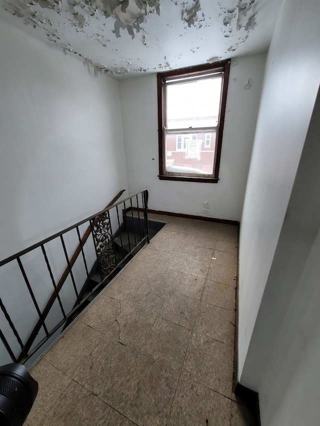 staircase featuring tile flooring