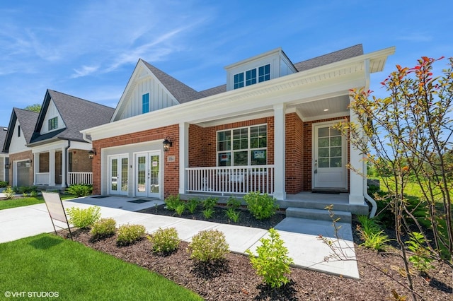 view of front of house with a porch and french doors