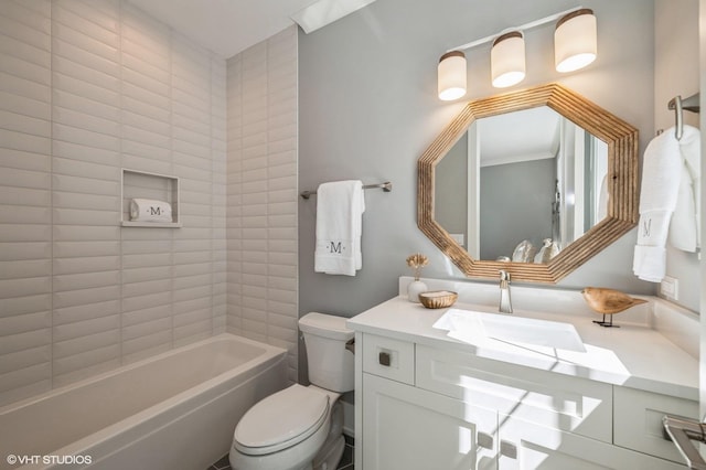 full bathroom with vanity, toilet, and tiled shower / bath combo