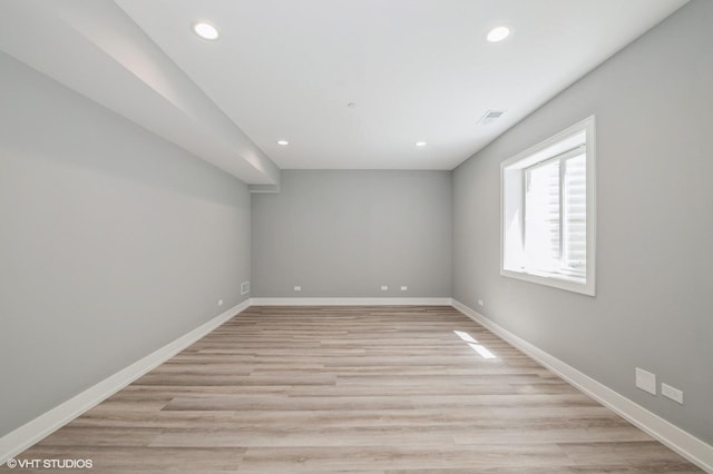 unfurnished room featuring light hardwood / wood-style flooring