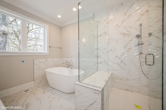 bathroom featuring tile floors, ornamental molding, separate shower and tub, and tile walls