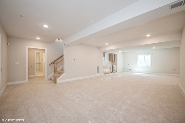 interior space with sink and light carpet