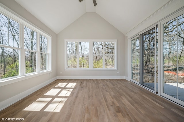 unfurnished sunroom with lofted ceiling