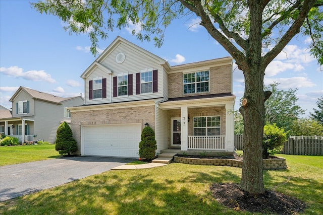 view of front of property with a garage, a front lawn, and a porch