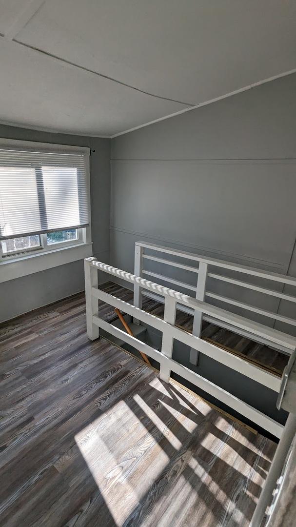 empty room featuring dark wood-type flooring