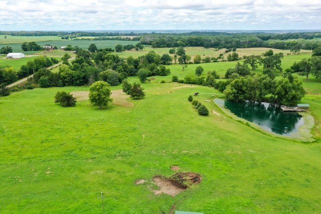 drone / aerial view with a rural view and a water view