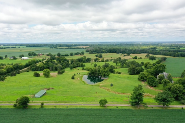 birds eye view of property with a rural view