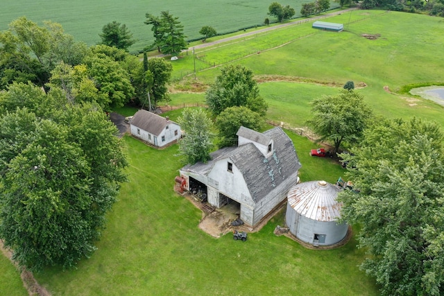 birds eye view of property with a rural view