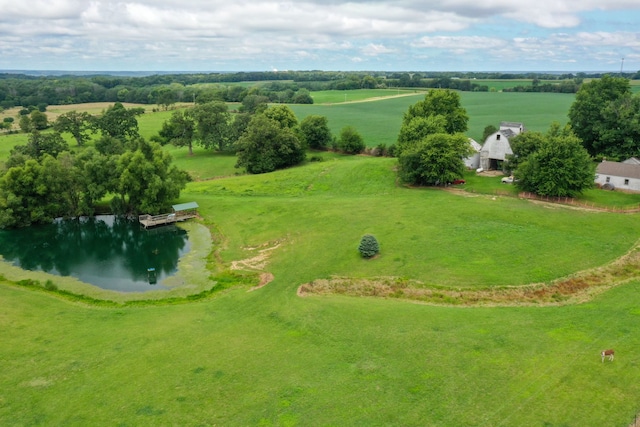 drone / aerial view featuring a water view and a rural view