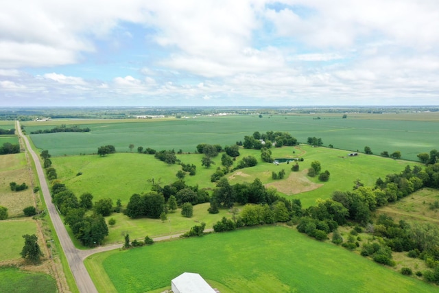 birds eye view of property with a rural view