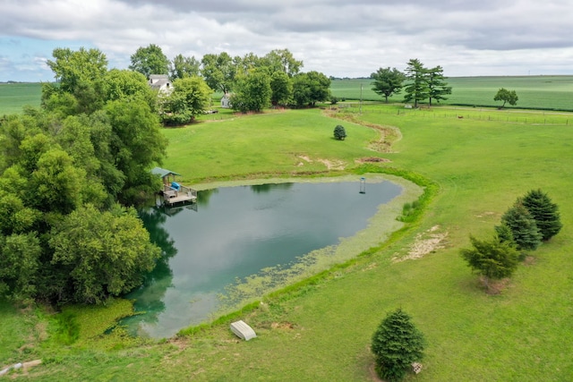 birds eye view of property featuring a rural view and a water view