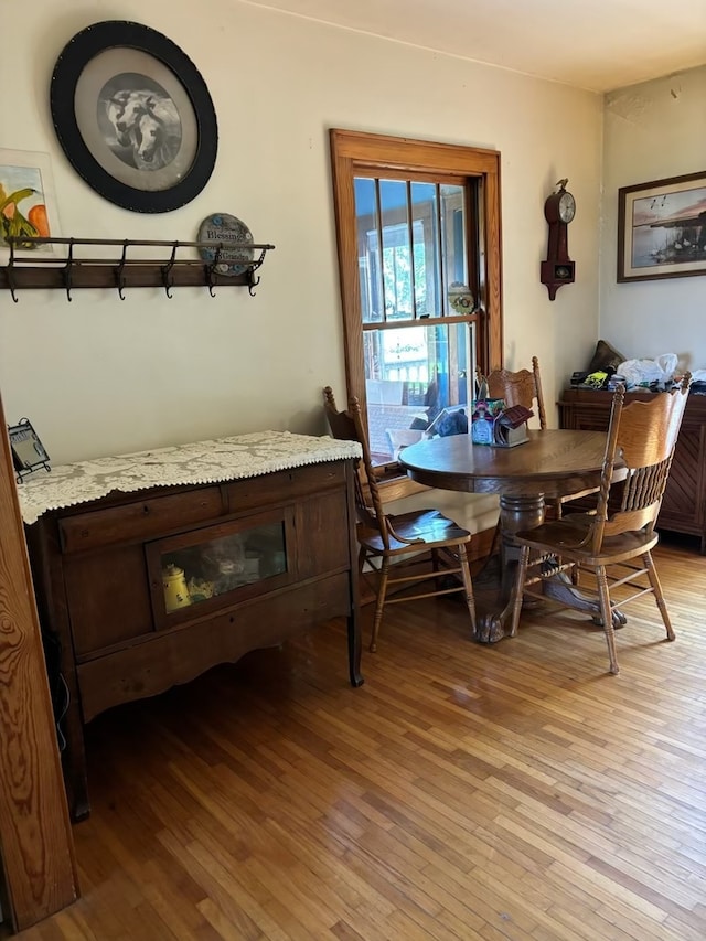 dining space featuring light wood-type flooring