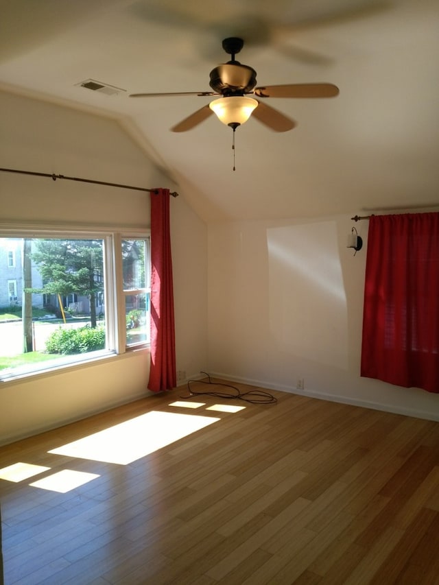 bonus room with hardwood / wood-style flooring, ceiling fan, and vaulted ceiling