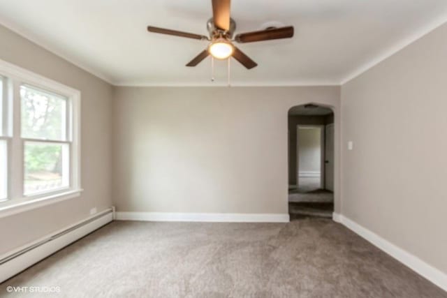 carpeted empty room with a baseboard radiator and ceiling fan