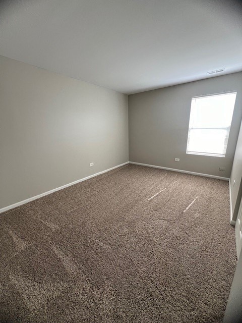 spare room featuring carpet floors