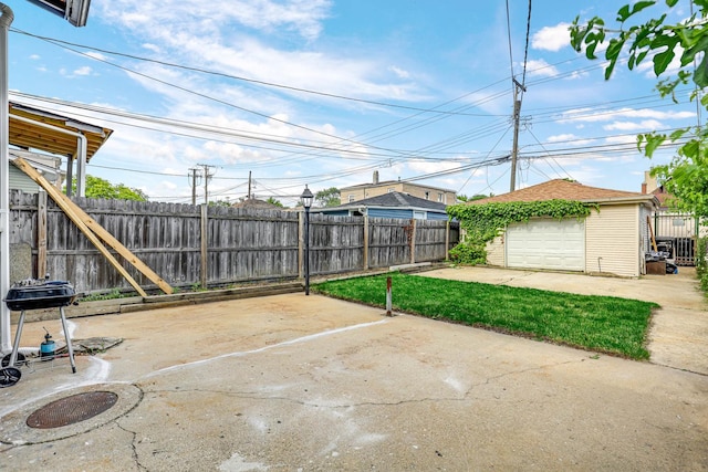 view of patio featuring a garage and an outdoor structure