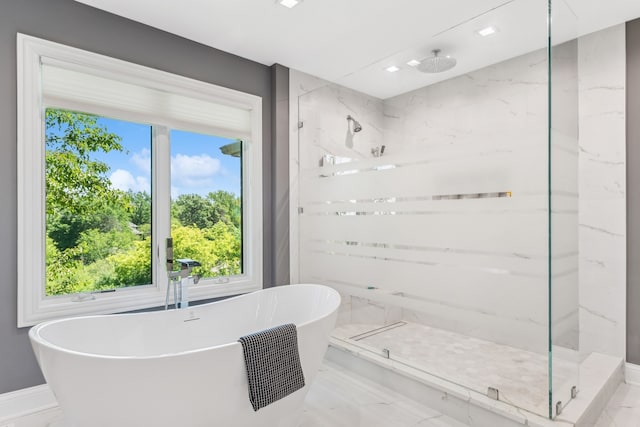 bathroom featuring tile patterned floors, independent shower and bath, and a healthy amount of sunlight