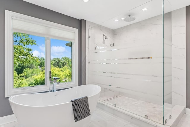 bathroom featuring independent shower and bath