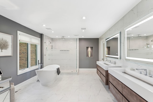 bathroom with double vanity, plus walk in shower, and tile patterned floors