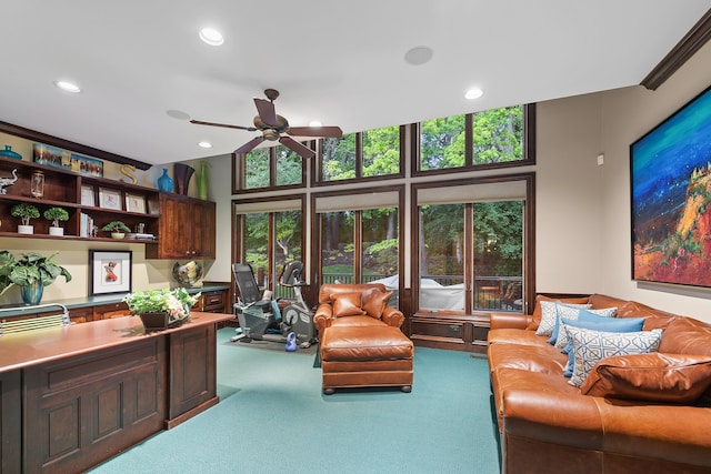 living room with carpet floors and ceiling fan