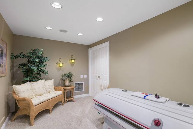 bedroom featuring light colored carpet