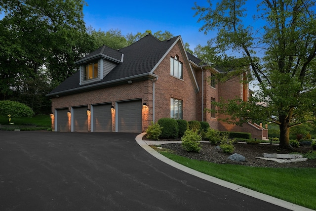 view of side of home with a garage