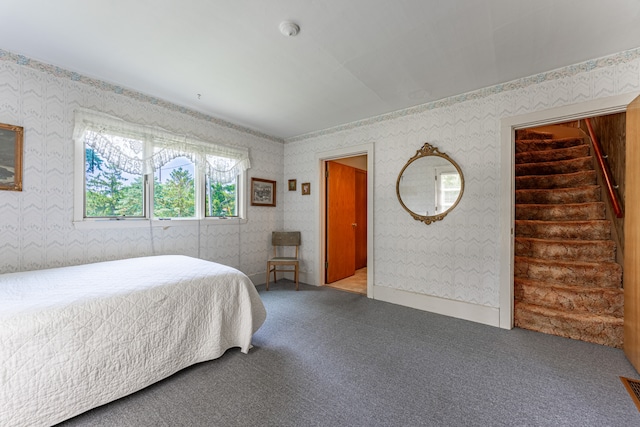 carpeted bedroom with wallpapered walls