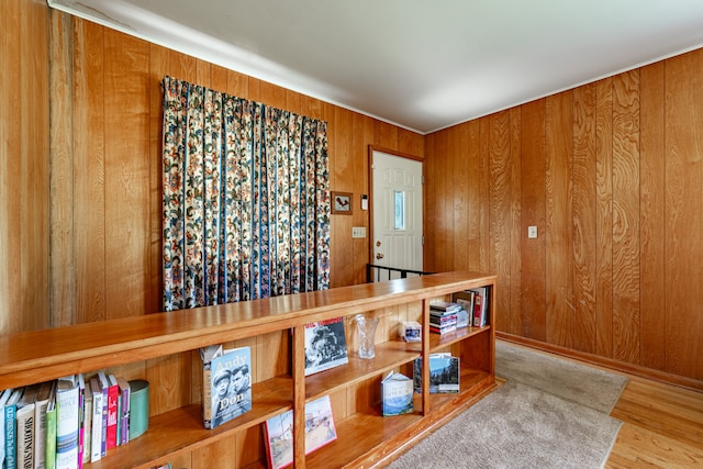 interior space featuring wood walls and wood finished floors