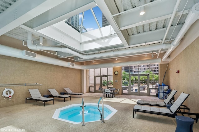 view of pool with french doors