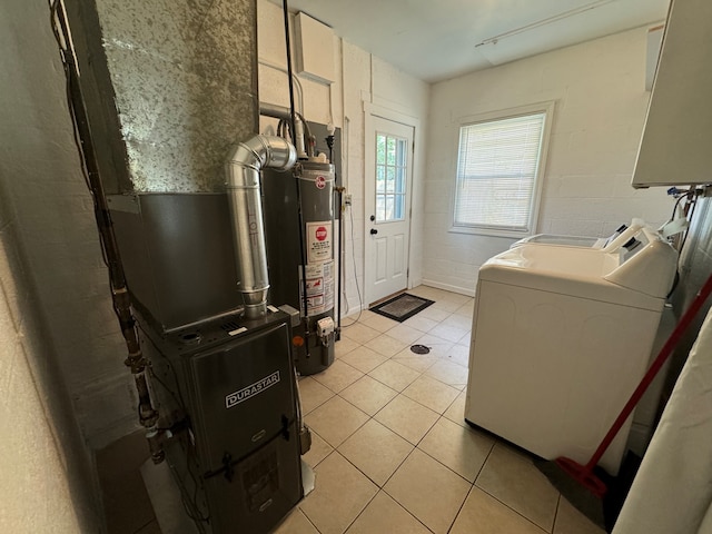 washroom with water heater and light tile patterned floors