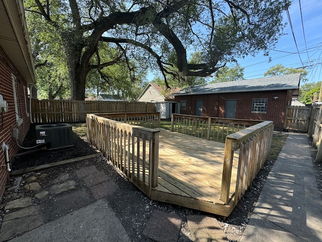 wooden terrace featuring central AC unit