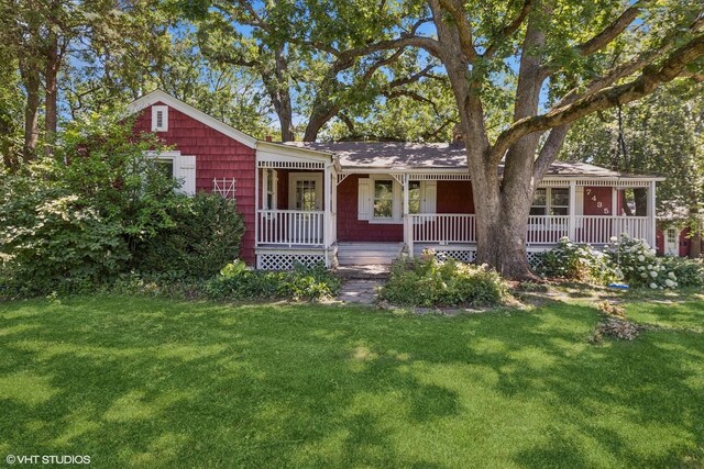 single story home featuring a front yard and a porch