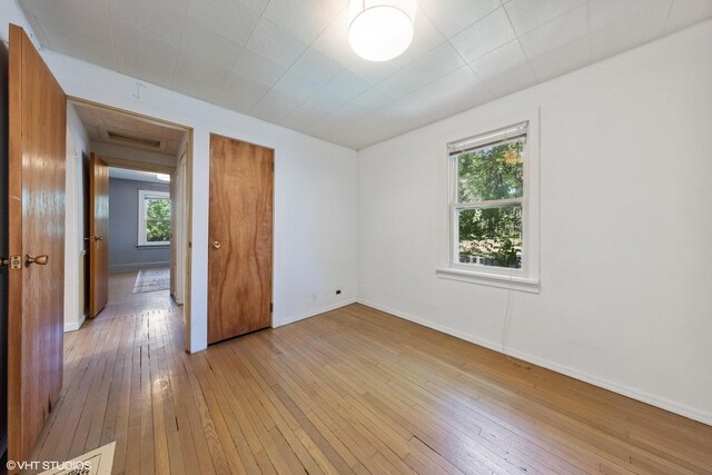 empty room with wood-type flooring