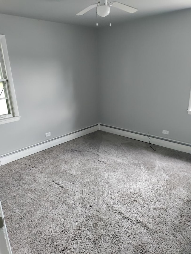 carpeted empty room featuring ceiling fan