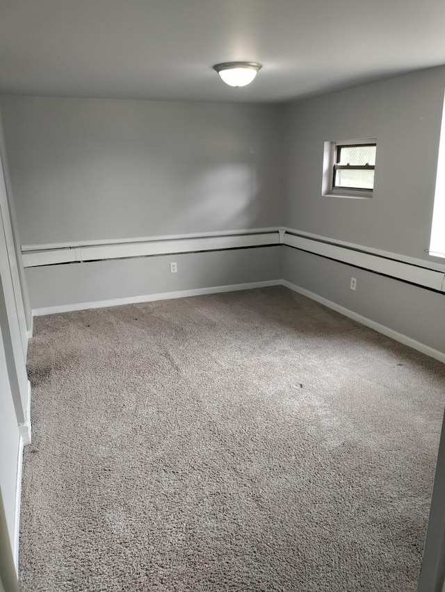 unfurnished room with carpet floors