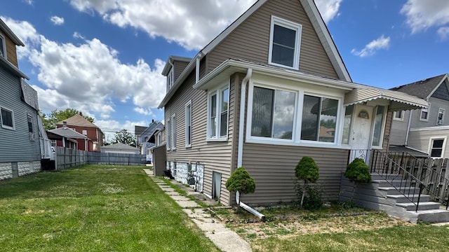 view of home's exterior featuring a yard