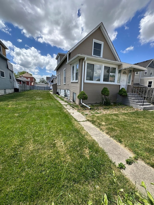 view of home's exterior with a lawn